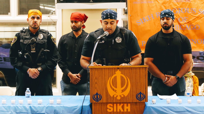 Officer Pardeep Singh Deol reading names of 94 police officers killed in line of duty this year_at candlelight vigil for Deputy Sandeep Singh Dhaliwal (1).JPG