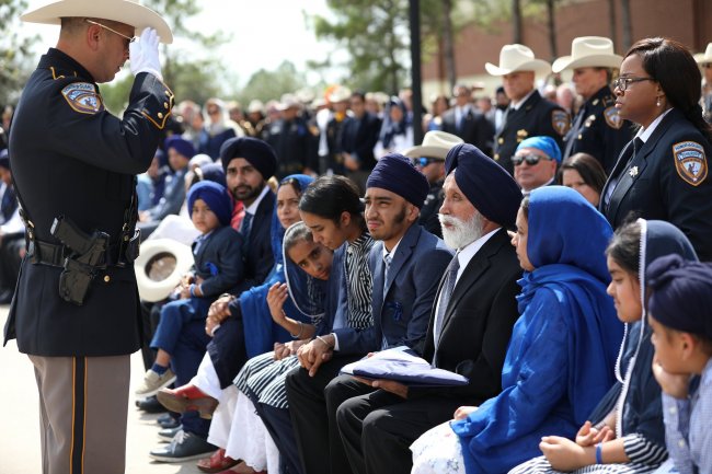 funeral of dhaliwal 16 family recieves salute.jpg